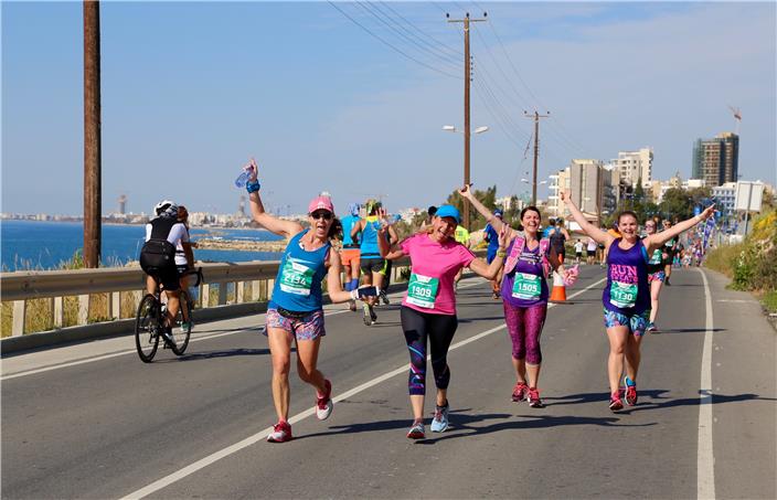 happy runners on coast Limassol